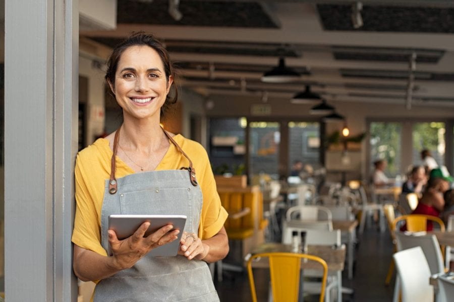 Small business owner getting new customers with modern technology