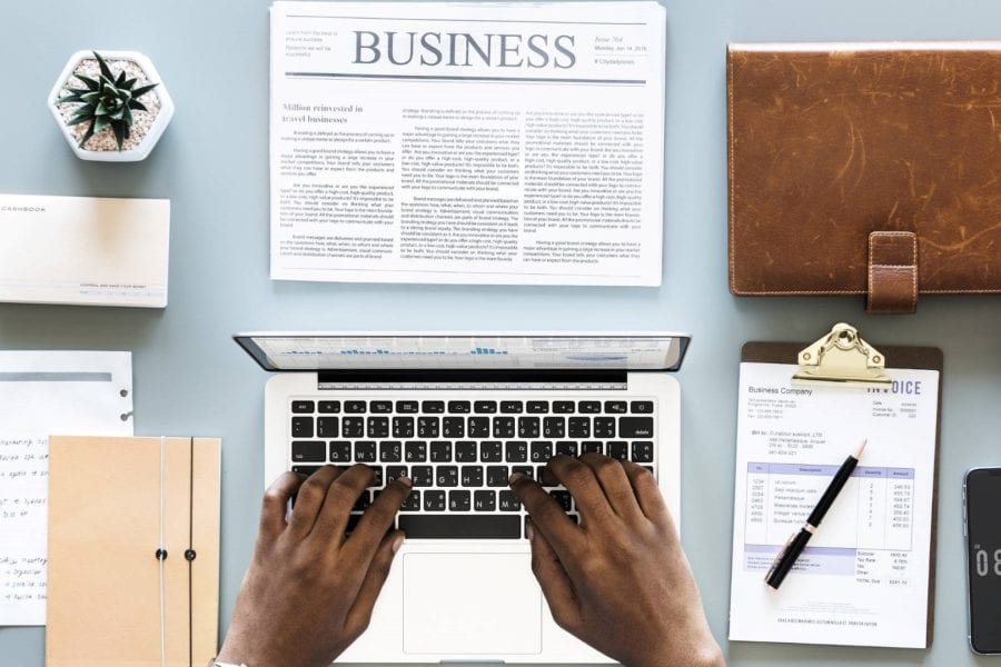 Arrangement of business items around laptop computer, for getting new customers during lockdown