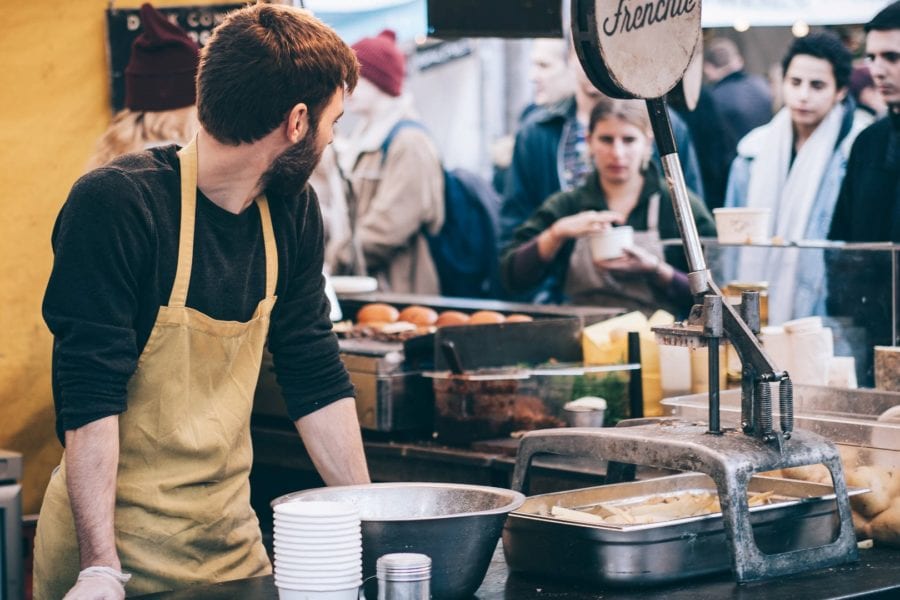 Food service worker is overwhelmed by many customers