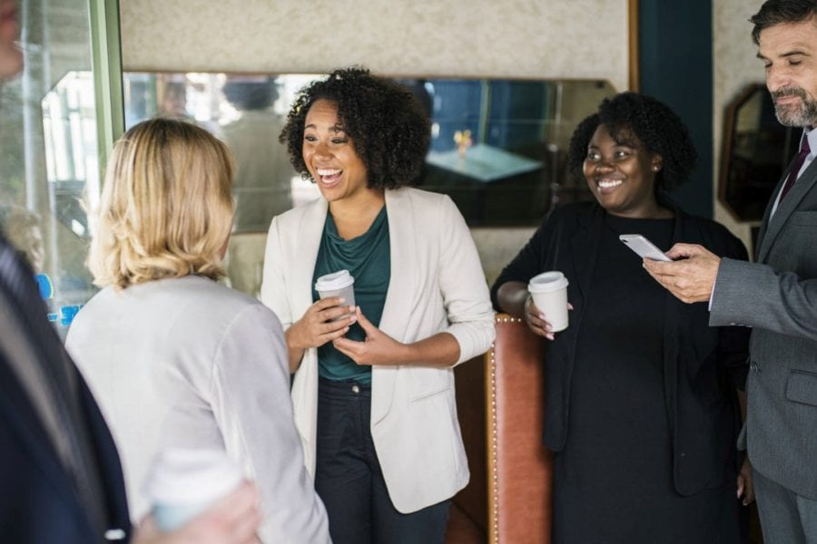 A business network meets over coffee at a café