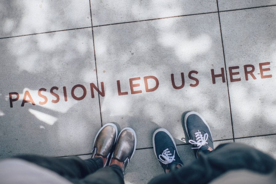 “Passion led us here,” painted on concrete