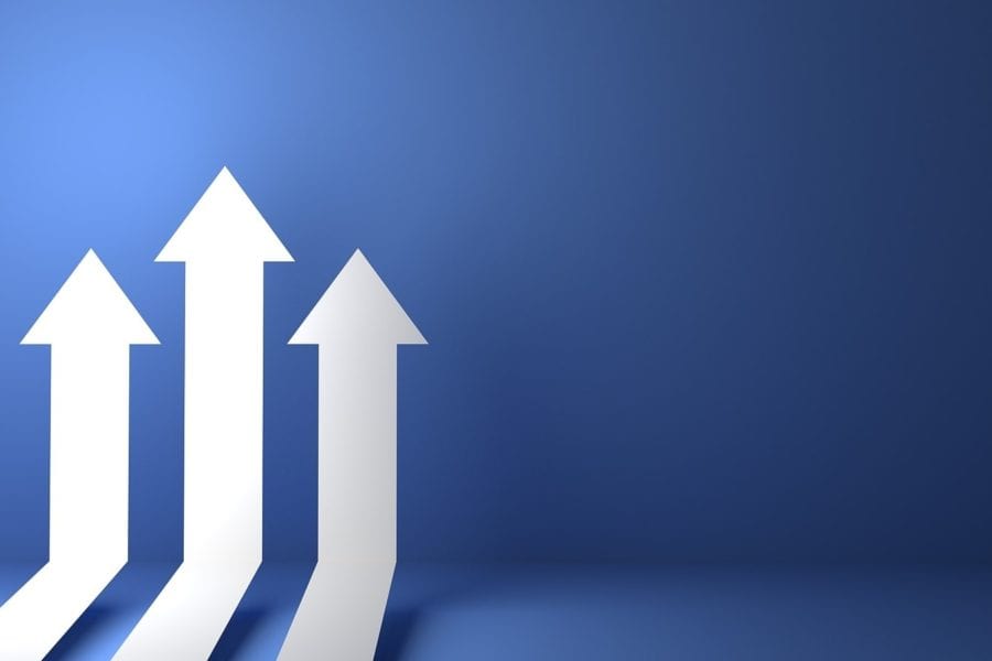 White arrows pointing up against blue background