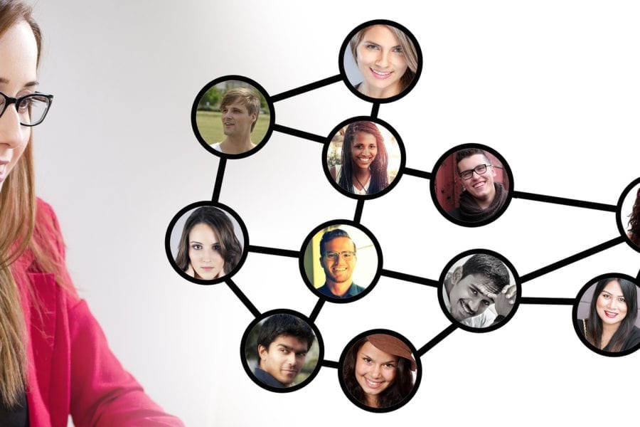 Woman looking at a photo montage of her business network