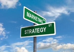 Street signs reading “Marketing Ave” and “Strategy St”