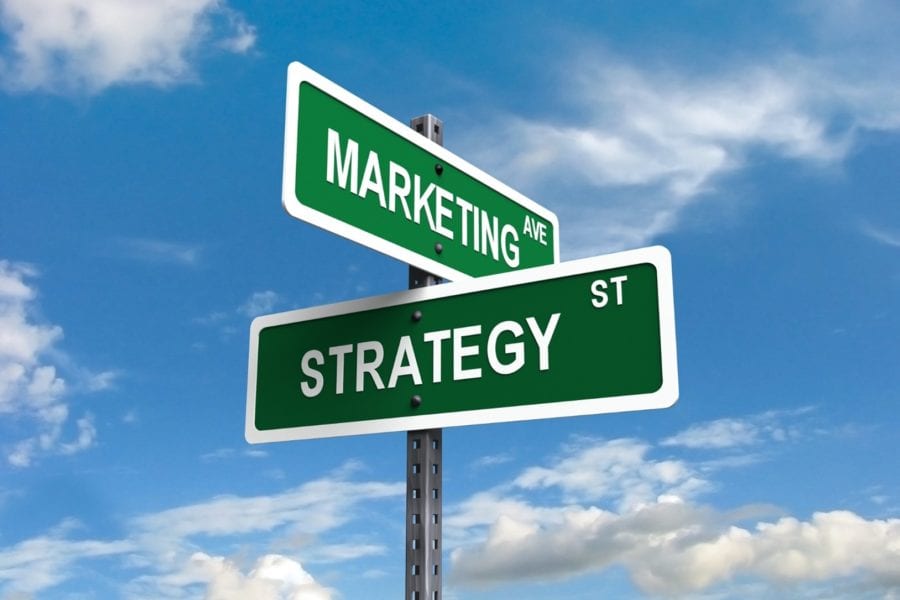 Street signs reading “Marketing Ave” and “Strategy St”