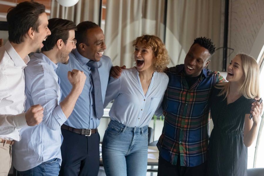 Happy employees share a laugh