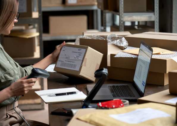 Warehouse worker helping company to clear excess stock