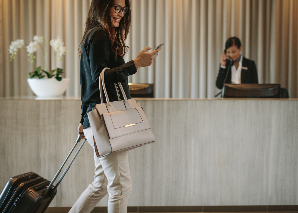 Lady walking into hotel to stay and help fill your empty beds