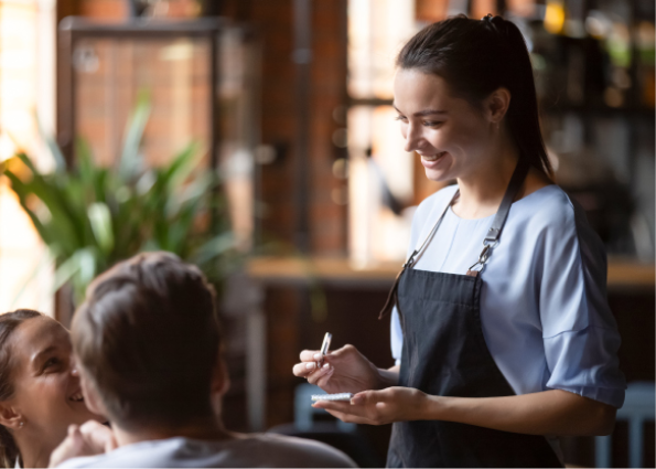 Cafe worker is taking order from customers to help cafe to sell excess inventory