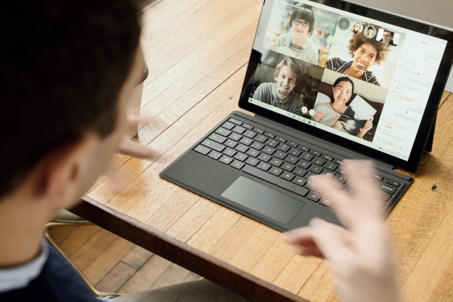 A person having a Zoom call with work colleagues