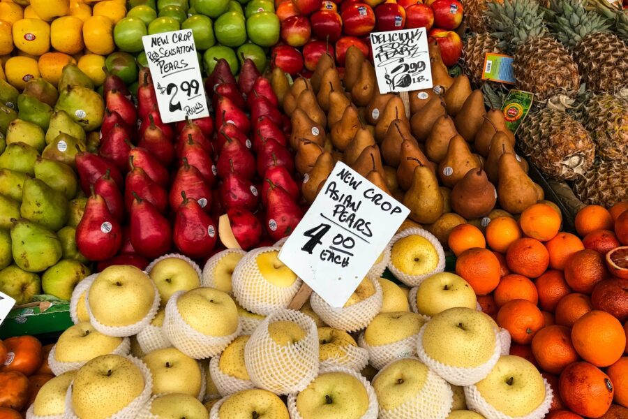 A fruit and veg stall displaying produce with price tags