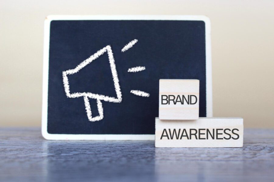 Wooden cubes with text brand awareness and drawing image of megaphone.